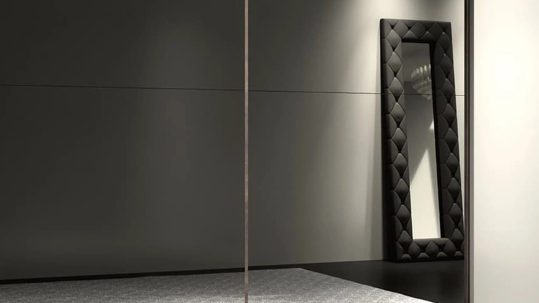 Specchiera Duse con cornice in ecopelle imbottita di Adriatica